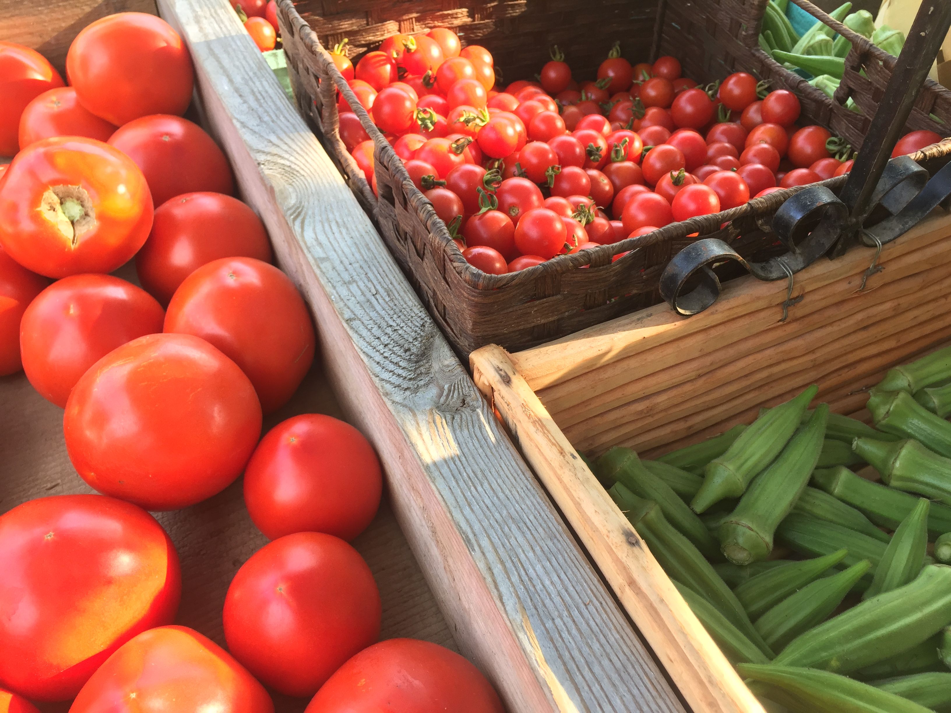 Image of baskets with vegetables on a farm stand